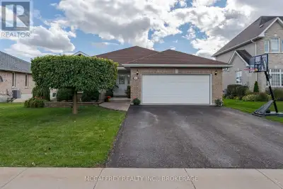 Welcome to this beautiful all-brick bungalow, where timeless curb appeal meets modern comfort and fu...