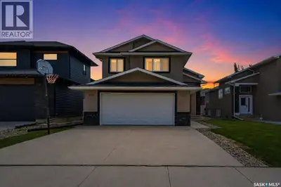 Welcome to 5122 Canuck Crescent in the prestigious community of Harbour Landing! This house is Built...