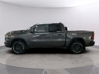 Meet the 2026 Ram 1500 Rebel 4x4 Crew Cab 57 Box: a commanding presence in a refined gray shade. Bui... (image 1)