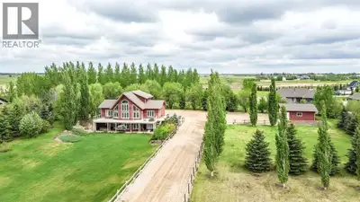 Enjoy the space and comfort of acreage living on 1.62 acres just outside Stettler. This impressive t...