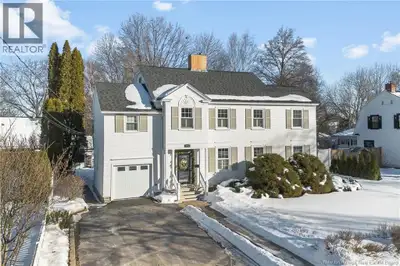 Nestled on a quiet, tree-lined street just steps from prestigious Waterloo Row, this beautiful colon...