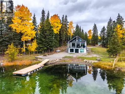 Peaceful waterfront living on sought-after Sheridan Lake. Completely renovated and designed to embra...