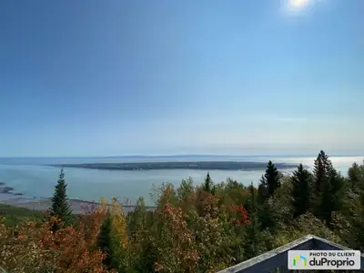 313 rue du Flanc, Les Éboulements (Qc) AU DOMAINE CHARLEVOIX. Beau terrain de plus de 4 000 m2 offra...