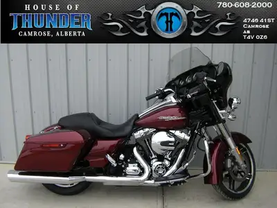 Hit the road in style with this 2014 Street Glide Special Harleys iconic touring bagger packed with...