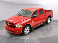 Introducing the Ram 1500 Classic Express 4x4 Crew Cab, a striking red truck that blends power and ca... (image 8)