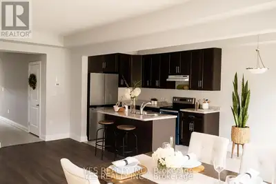 Stunning 3-bedroom, 3-bathroom end-unit townhome available for lease! -This home boasts a spacious o...