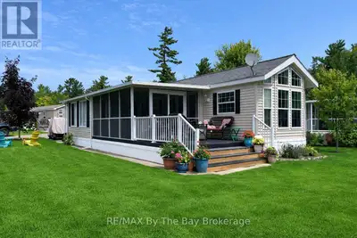 Golf cart included! Embrace the charm of a seasonal retreat in the coveted Countrylife Resort, where...
