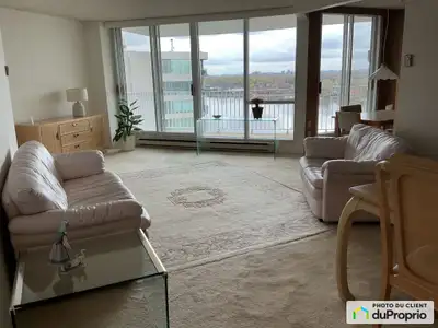 Le LAURIER, une luxueuse copropriété de l'Ile Paton, se trouve en bordure de la Rivière des Prairies...