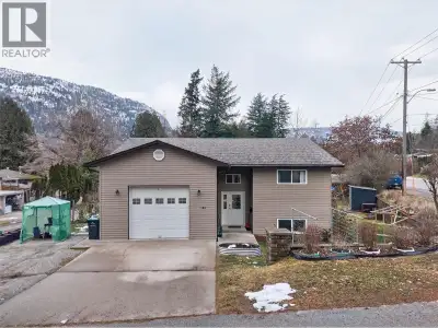 Nestled in a peaceful Castlegar neighborhood, this impeccably maintained 2,132-sq-ft home offers a p...