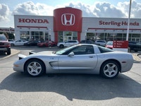 Turn heads in this sleek 1999 Chevrolet Corvette, boasting a stunning Sebring Silver Metallic exteri... (image 9)