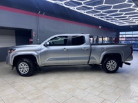The 2025 Toyota Tacoma SR5, clad in a refined Silver finish, is ready to tackle any terrain with its... (image 3)