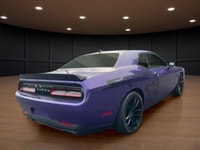 The 2023 Dodge Challenger SRT Hellcat Jailbreak in a stunning purple hue captivates with its rear-wh... (image 5)