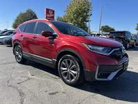 This 2021 Honda CR-V Sport, boasting a vibrant Radiant Red Metallic exterior and a sleek black inter... (image 1)