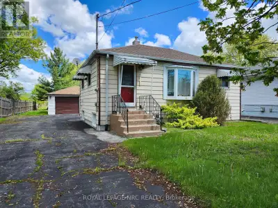 STARTING OUT OR DOWNSIZING? COUNTRY LIVING and MINUTES TO TOWN, BEACHES, AND GOLF! This bungalow is...