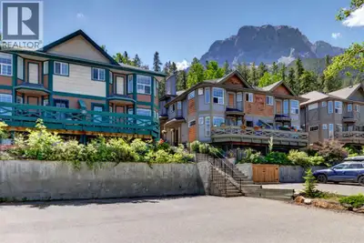 Fourplex footsteps to Quarry Lake with mountain views. Perfectly positioned at the front of the comp...
