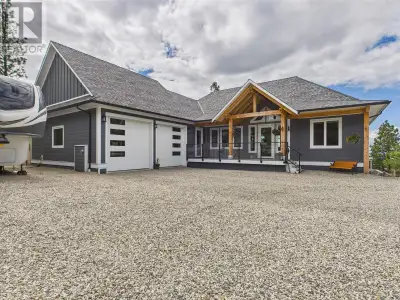 Welcome to 125 Falcon Place–timber frame custom-built executive lake view home nestled on Anarchist...
