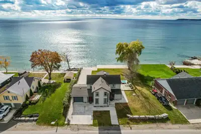 FOR SALE - UPSCALE LAKEFRONT RETREAT WITH PRIVATE BOAT LAUNCH…Escape to 2952 North Shore Drive in Lo...