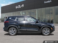 Navigate Canadian roads with confidence and style in this stunning Black 2023 Kia Seltos EX Sport Ut... (image 6)