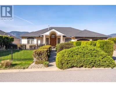 Large well built rancher with walk-out lower floor offering panoramic views of both lakes, mountains...