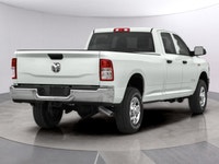 The 2021 Ram 3500 Tradesman, proudly presented in a pristine White finish, is a powerhouse of capabi... (image 1)