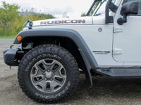 The 2018 Jeep Wrangler JK Unlimited Rubicon in stunning white with an all-wheel-drive system invites... (image 5)