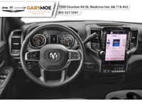 The 2026 Ram 3500 Laramie 4x4 Crew Cab with an 8 Box is a commanding presence, featuring a bold blue... (image 3)