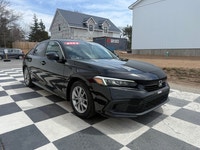 A modern and efficient compact sedan with a refined interior, advanced safety features, and smooth t... (image 2)