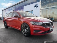 The 2019 Volkswagen Jetta Highline, presented in eye-catching Habanero Orange Metallic with a sophis... (image 6)