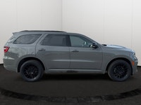 Experience the ultimate fusion of muscle-car attitude and three-row utility in this aggressive SUV,... (image 5)