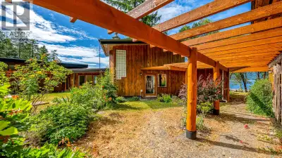 Glass, wood, concrete and stone: set on a stunning west-facing oceanfront lot, this custom home by M...