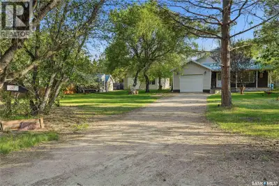 Welcome to 242 Woodlawn Avenue in Sandy Beach, a rare opportunity to own a peaceful lakeside retreat...