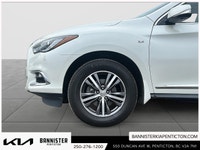 The 2017 INFINITI QX60 AWD in elegant white is a true performer with its reliable all-wheel drive an... (image 6)