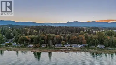 Rare opportunity to own more than a quarter acre of walk on waterfront in Courtenay with major updat...