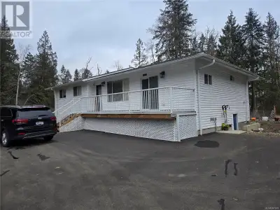 Enjoy the beauty of Nanoose creek that passes through the middle of this 2.75 acres property, and ye...