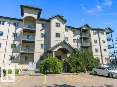 Top Floor Corner Unit with Stunning Golf Course & City Views! Welcome to The Village Green in Lewis...