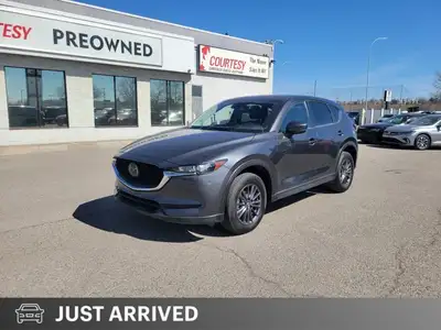 Command every journey with confidence and sophistication in this Machine Grey Metallic 2021 Mazda CX...