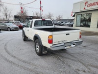 Built to tackle any adventure or workday, this 2004 Toyota Tacoma Extended Cab Pickup combines legen... (image 2)