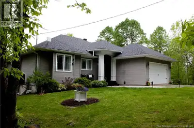 Enjoy breathtaking river views from both levels of this beautifully designed waterfront ranch. A gra...