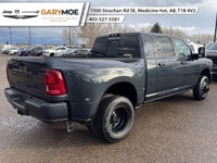 Experience the power and finesse of the 2026 Ram 3500 Laramie 4x4 Mega Cab, cloaked in a bold blue t... (image 2)
