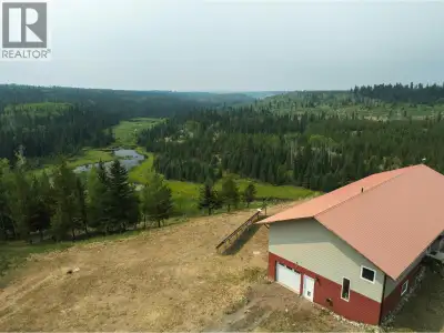 Rare 160-acre Rayfield River waterfront estate offering breathtaking panoramic mountain and river vi...