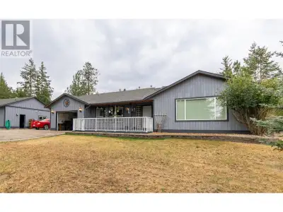 Quiet 4.11 acre property with 1400 sq.ft. single-level home and 26'x31' two bay detached shop with 2...