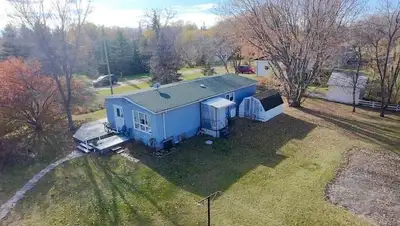 R33//Oak Lake/Welcome home! This charming 3-bedroom property sits on a large, beautifully landscaped...