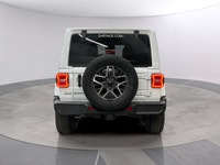 Experience the rugged charm of the new 2026 Jeep Wrangler Sahara 4 Door 4x4 in a striking white fini... (image 3)