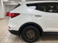 Powerful confidence wrapped in Frost Whitethis 2018 Hyundai Santa Fe 2.4 SE All-Wheel Drive SUV is e... (image 5)