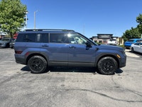 Ready for any adventure or daily commute, this striking Atlantis Blue 2025 Hyundai Santa Fe XRT is e... (image 3)