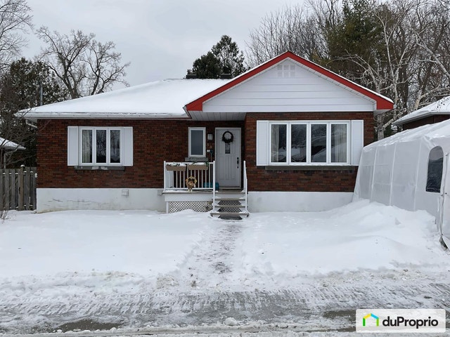 $599,000 - Bungalow for sale in Laval-des-Rapides — photo 1