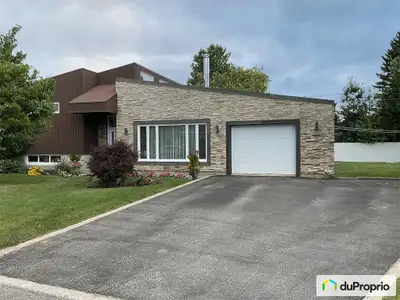 Charmante maison unifamiliale à paliers quartier paisible et recherché Située dans un secteur tranqu...