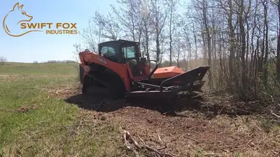 Powerful high flow 72” and 84" open front skid steer brush cutter. Cuts grass, shreds and mulches br...