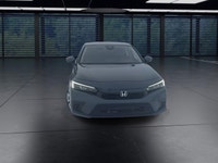 The 2024 Honda Civic Sedan LX-B CVT in sophisticated gray combines front-wheel drive with precise ha... (image 2)