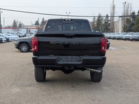 The 2026 Ram 2500 Limited Mega Cab Night Edition in Diamond Black Crystal Pearl delivers bold stylin... (image 4)